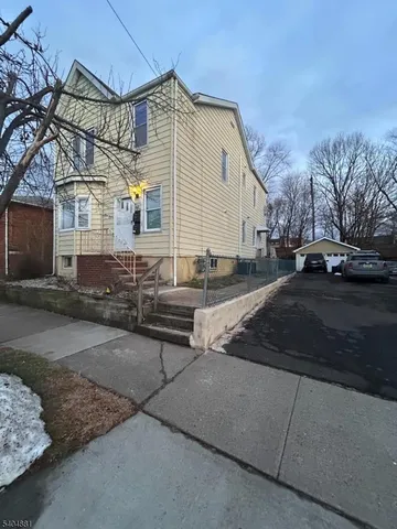 a backyard of a house with outdoor seating