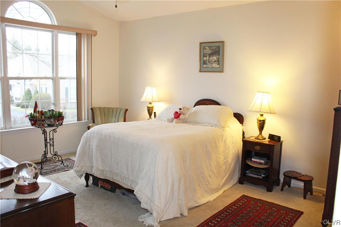 1888 Gregory Place Hellertown, PA 18055 - Photo 15 of 33 a bedroom with a bed and wooden floor