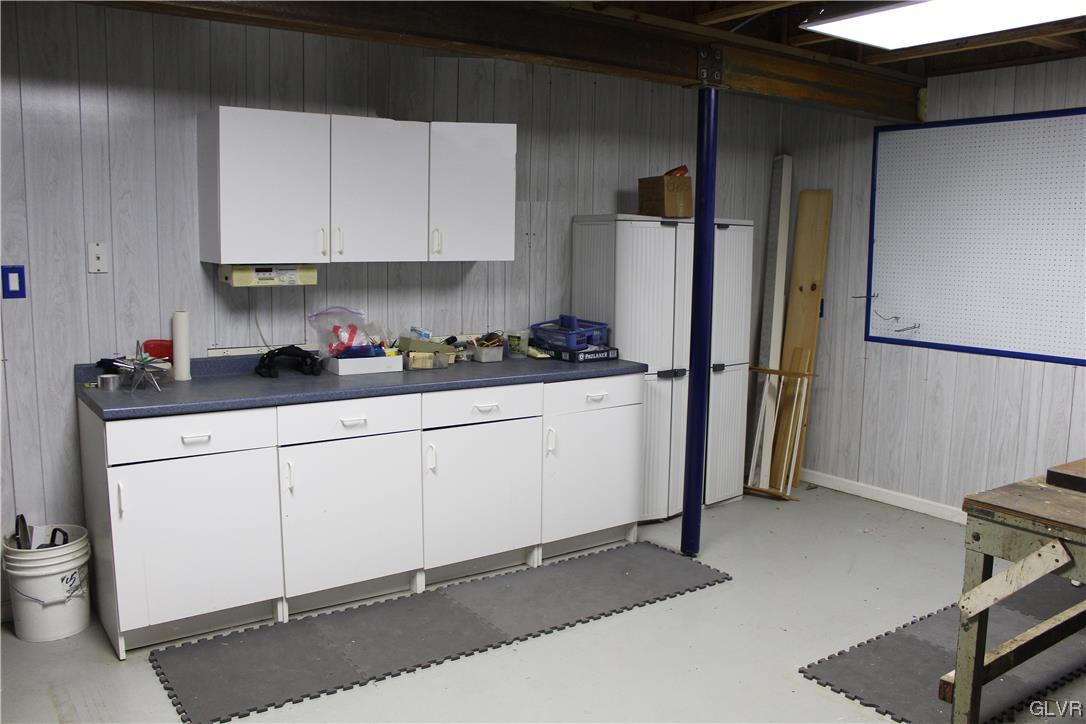 1888 Gregory Place Hellertown, PA 18055 - Photo 24 of 33 a kitchen with a sink a refrigerator and cabinets