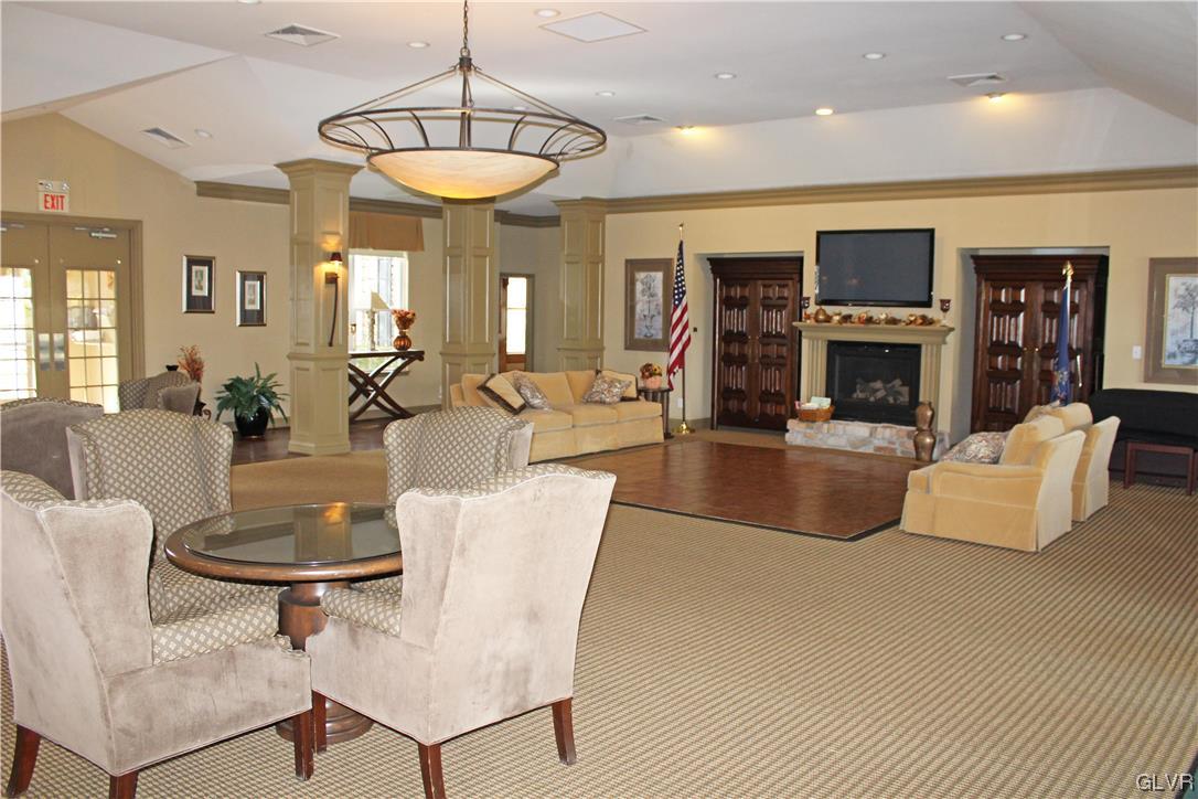 1888 Gregory Place Hellertown, PA 18055 - Photo 27 of 33 a living room with fireplace furniture and a flat screen tv