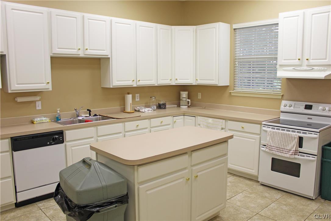 1888 Gregory Place Hellertown, PA 18055 - Photo 30 of 33 a kitchen with a sink stove and cabinets