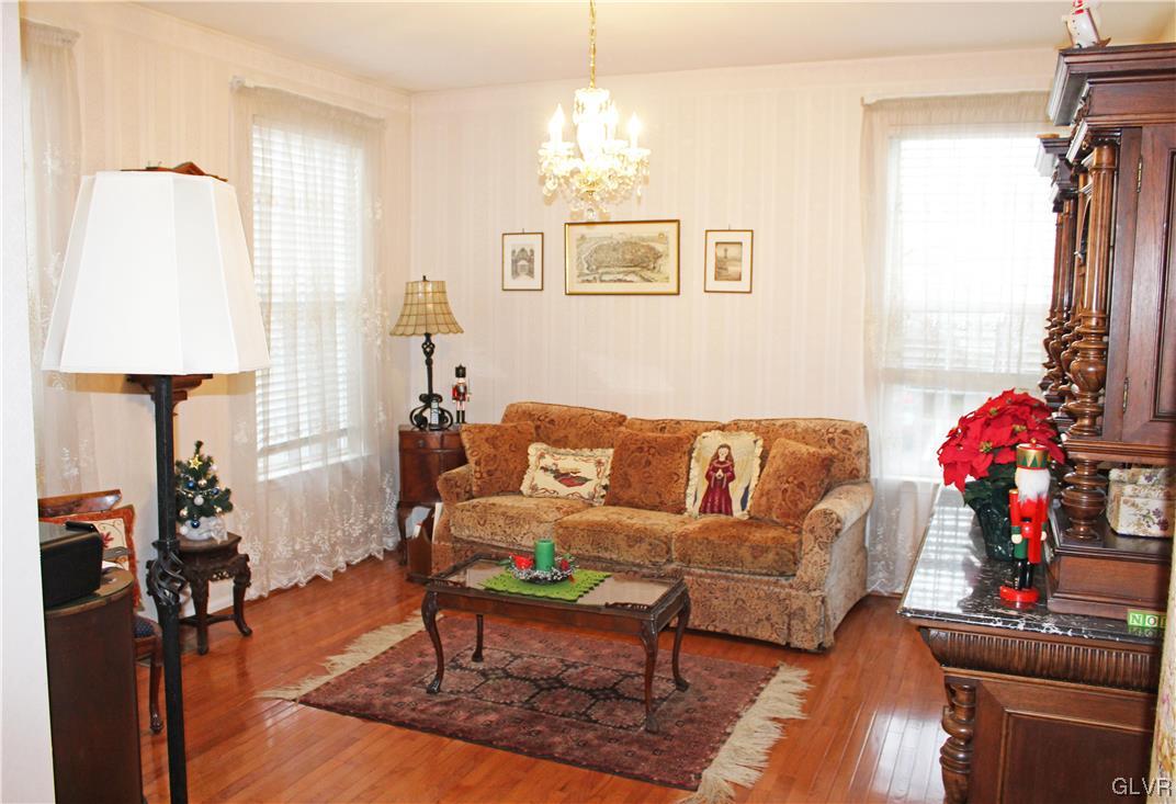 1888 Gregory Place Hellertown, PA 18055 - Photo 3 of 33 a living room with furniture and a chandelier