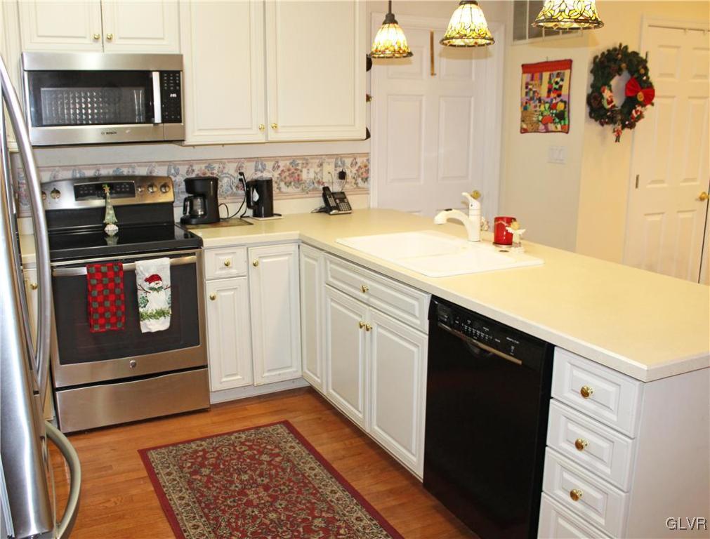 1888 Gregory Place Hellertown, PA 18055 - Photo 7 of 33 a kitchen with stainless steel appliances granite countertop a sink and a stove