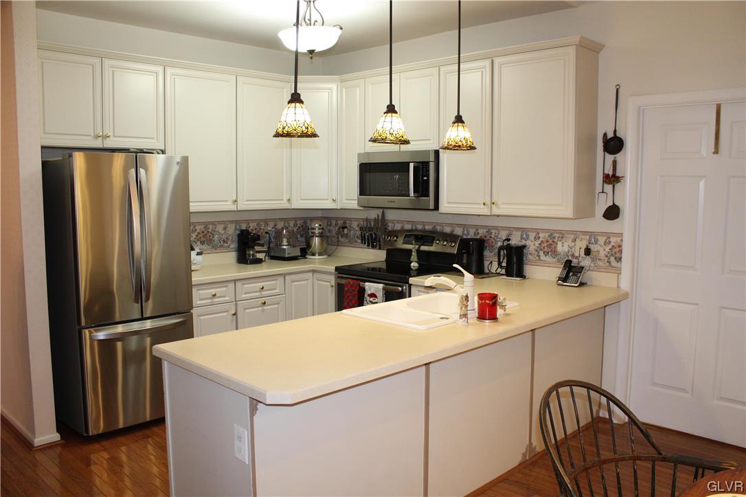 1888 Gregory Place Hellertown, PA 18055 - Photo 8 of 33 a kitchen with stainless steel appliances a refrigerator sink and microwave