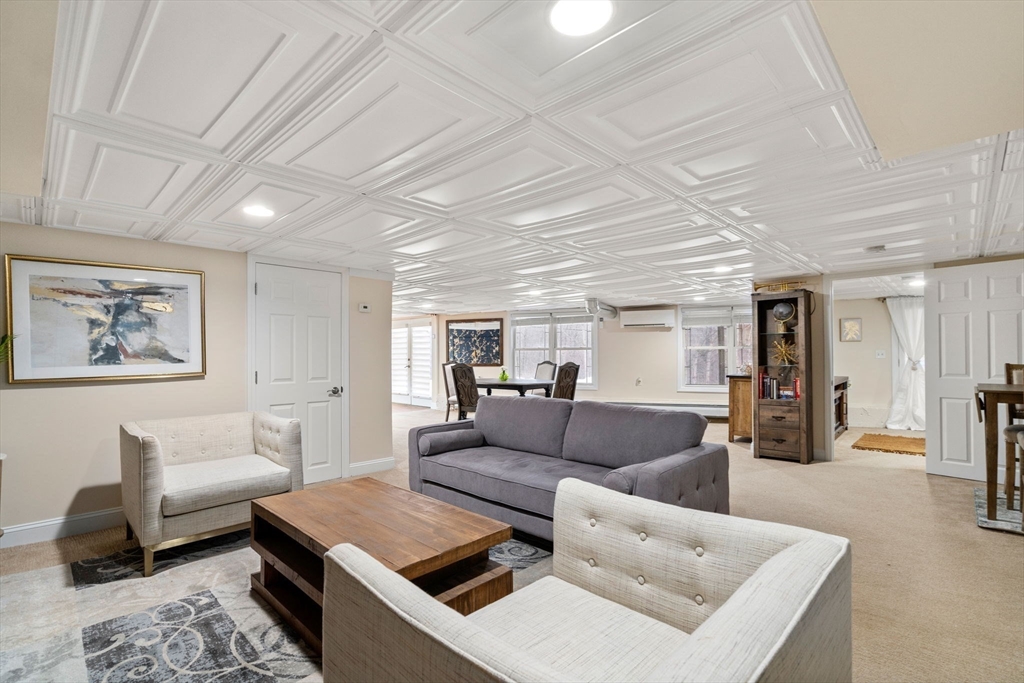 242 Boston Road Sutton, MA 01590 - Photo 24 of 39 a living room with furniture and wooden floor