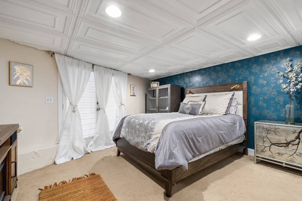 242 Boston Road Sutton, MA 01590 - Photo 26 of 39 a spacious bedroom with a bed and a window