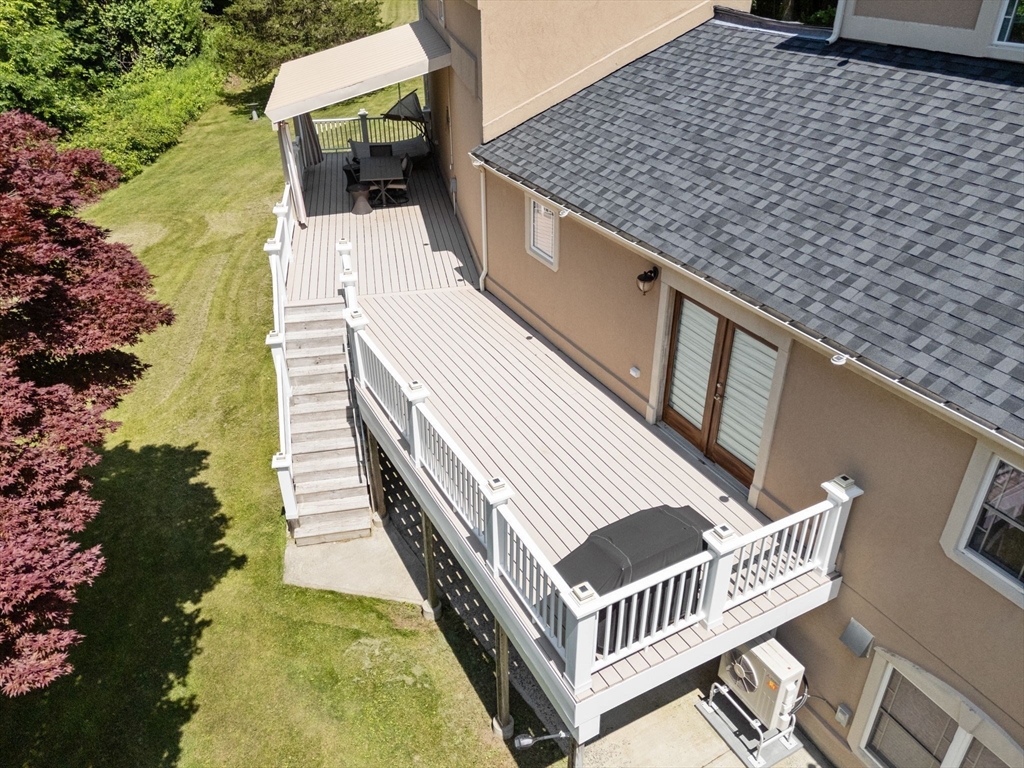 242 Boston Road Sutton, MA 01590 - Photo 30 of 39 a balcony with table and chairs