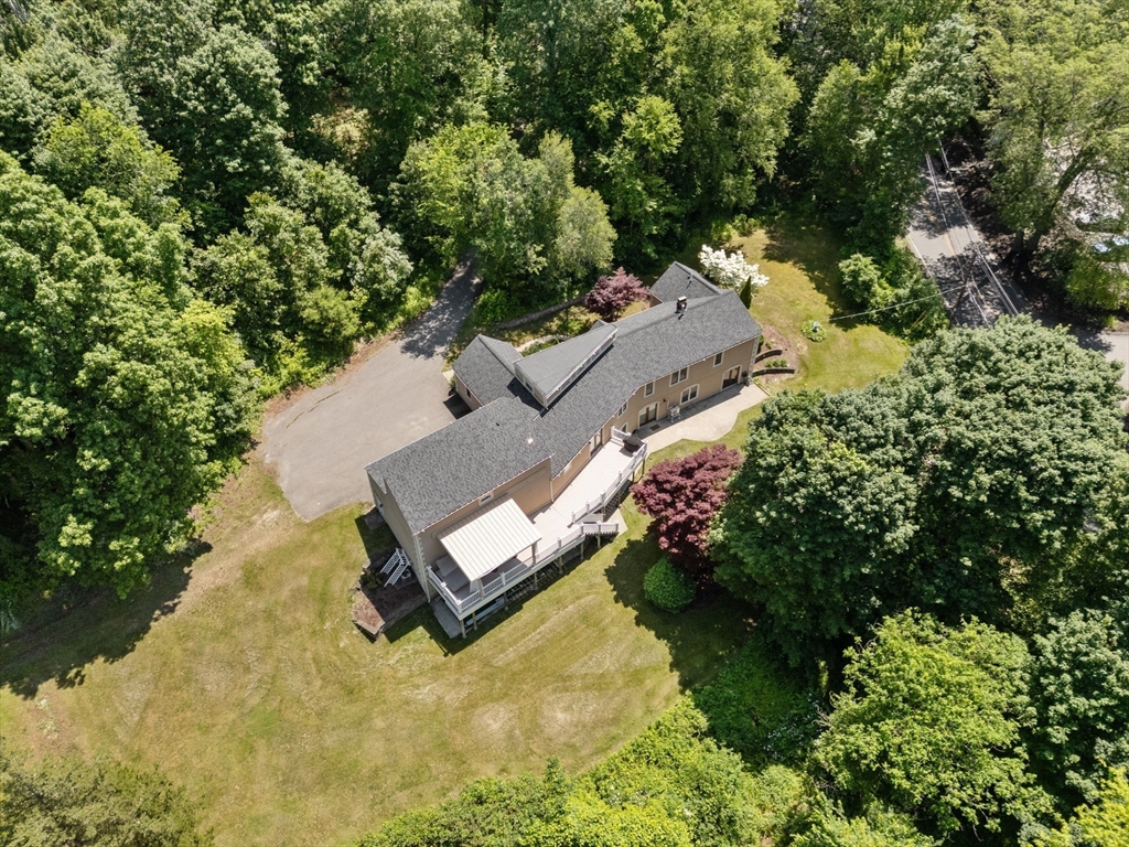 242 Boston Road Sutton, MA 01590 - Photo 32 of 39 an aerial view of a house with a yard and swimming pool
