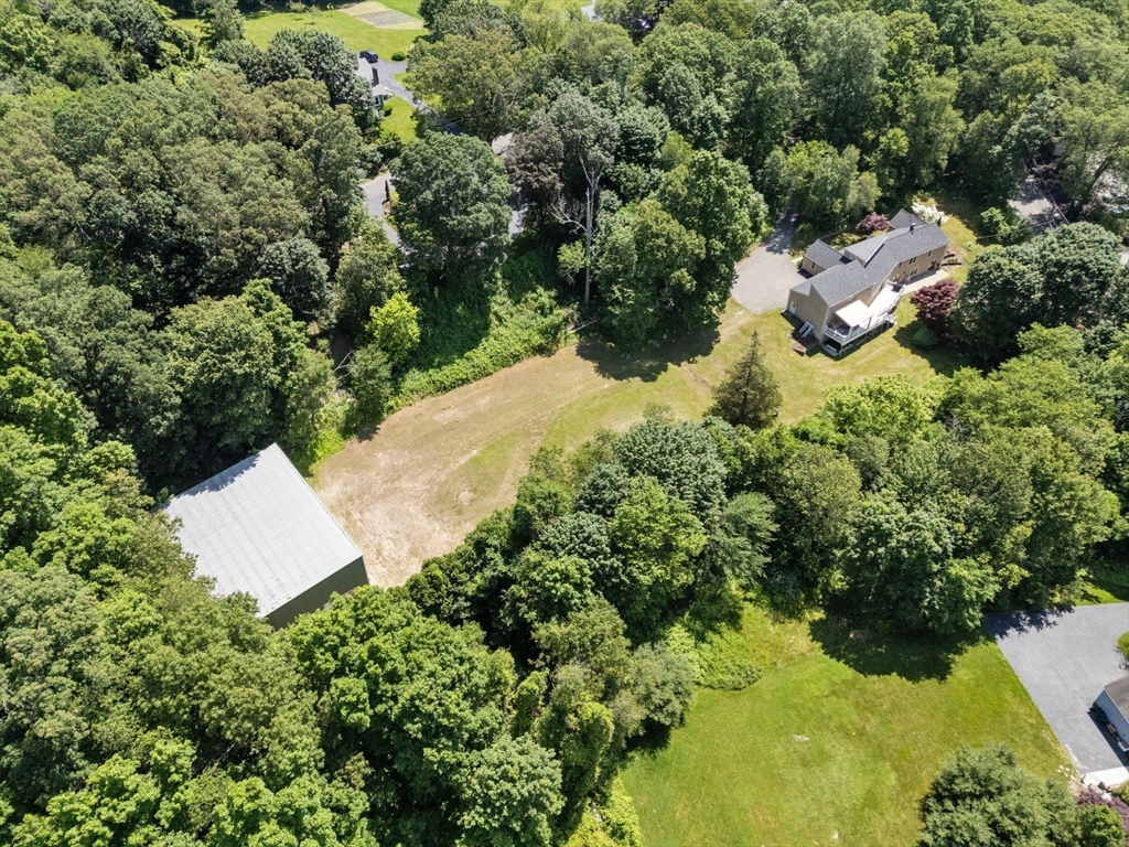 242 Boston Road Sutton, MA 01590 - Photo 39 of 39 an aerial view of a house with yard and outdoor seating