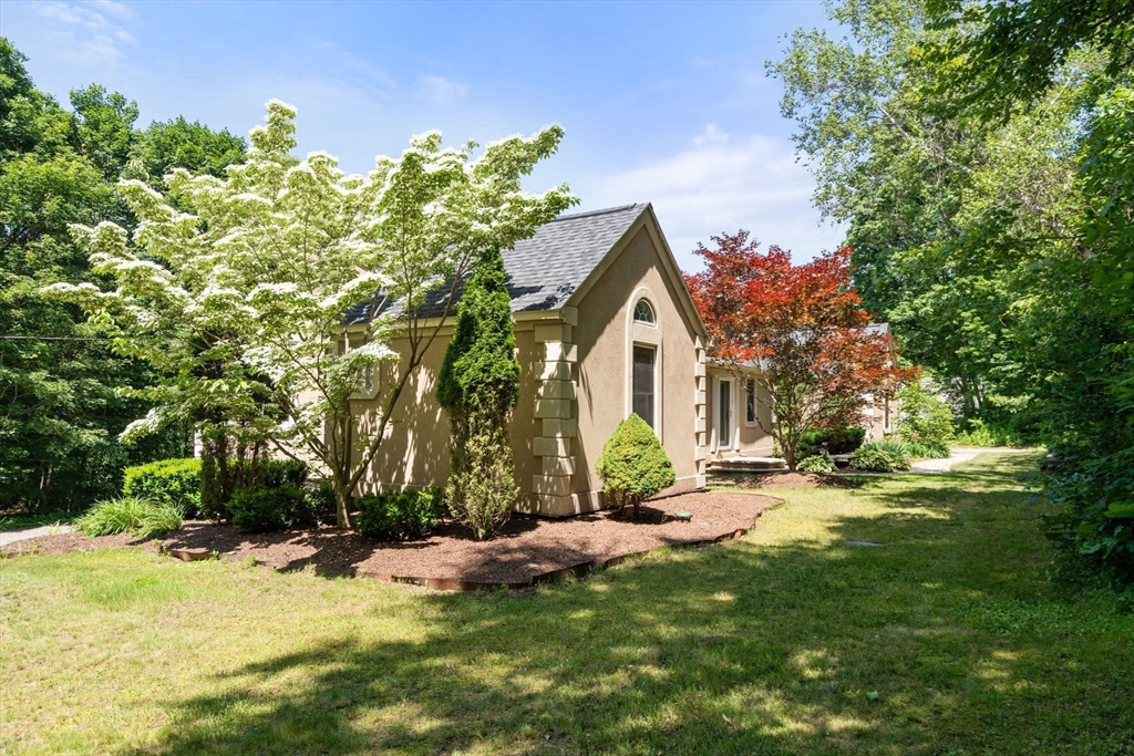 242 Boston Road Sutton, MA 01590 - Photo 5 of 39 a view of a house with a yard