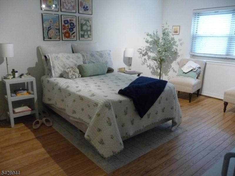 29 Up Mountain Avenue, Unit 2 Montclair, NJ 07042 - Photo 12 of 15 a bedroom with a bed couch and a window