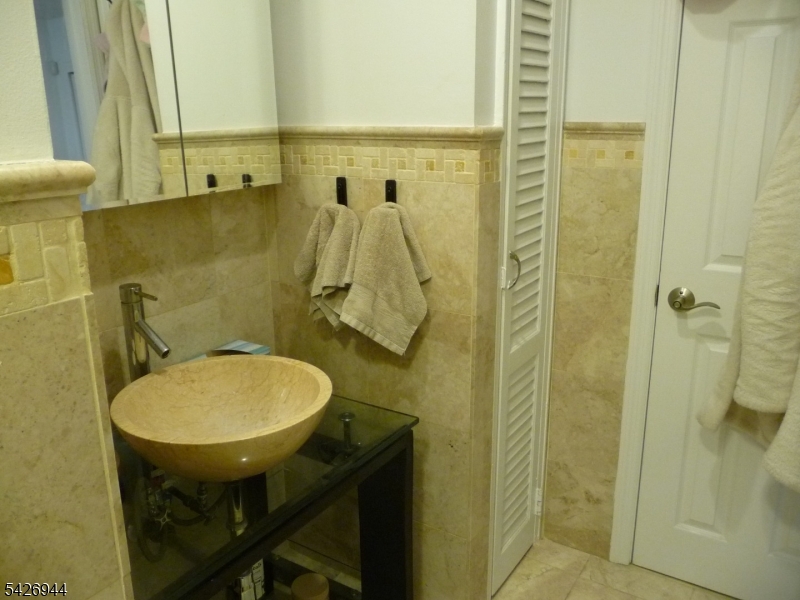 29 Up Mountain Avenue, Unit 2 Montclair, NJ 07042 - Photo 13 of 15 a bathroom with a sink mirror and toilet