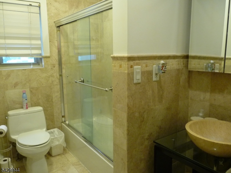 29 Up Mountain Avenue, Unit 2 Montclair, NJ 07042 - Photo 14 of 15 a bathroom with a sink and a toilet