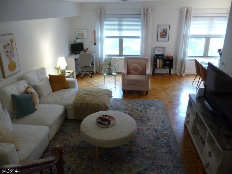 29 Up Mountain Avenue, Unit 2 Montclair, NJ 07042 - Photo 4 of 15 a living room with furniture and a fireplace
