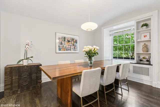 a dining room with furniture and window
