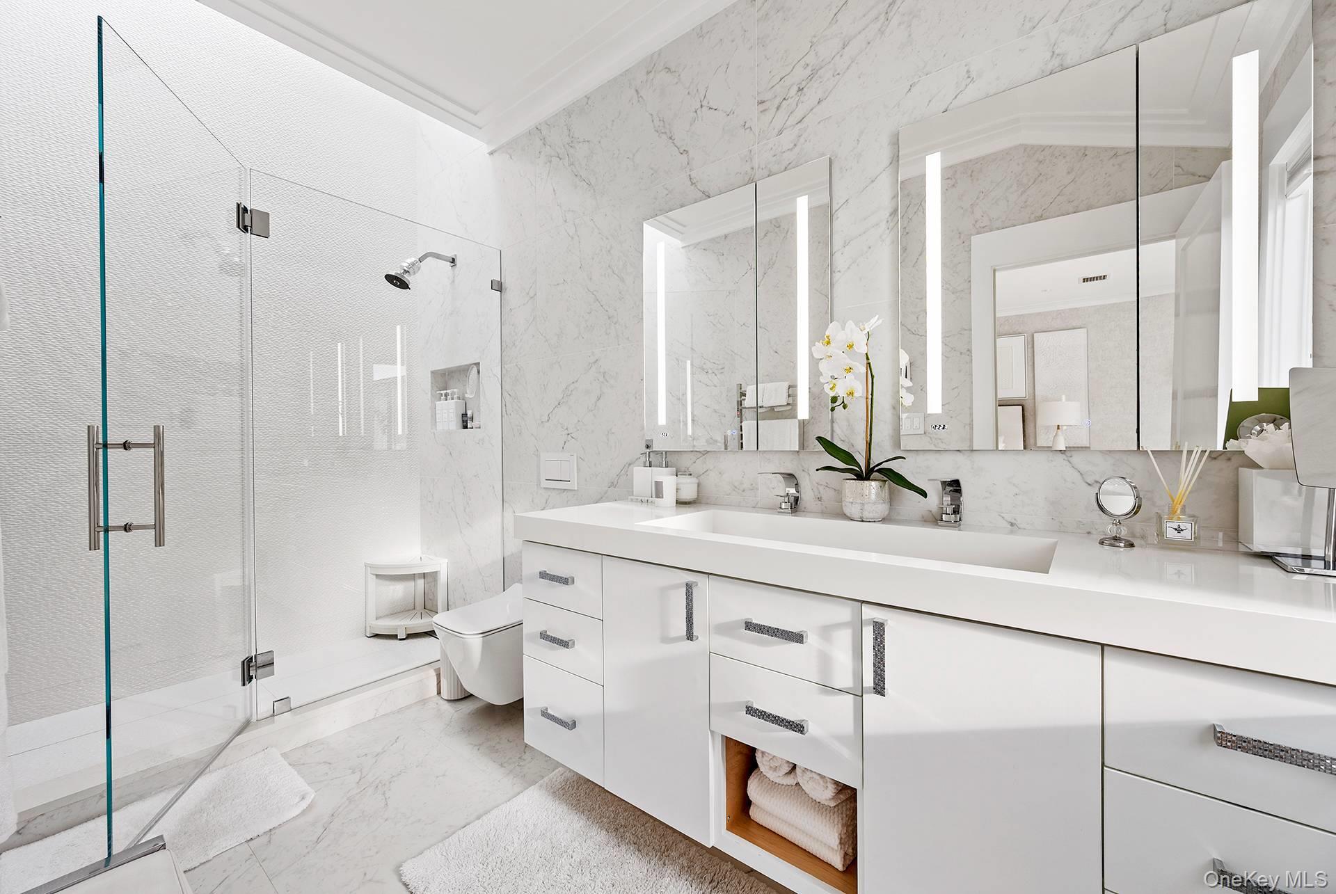 54 Glade Road East Hampton, NY 11937 - Photo 15 of 35 a bathroom with a double vanity sink mirror and toilet
