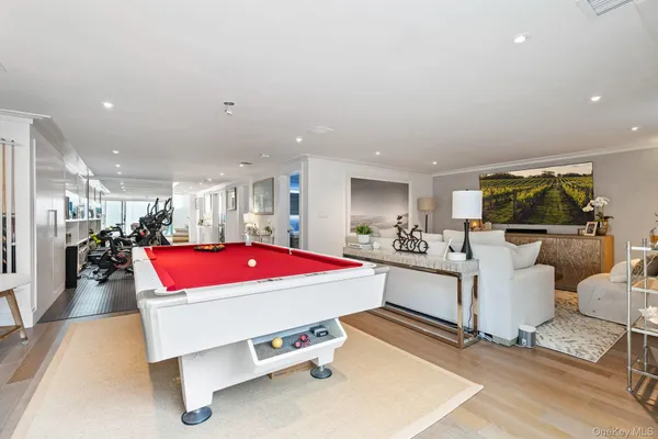a room with table soccer and kitchen view