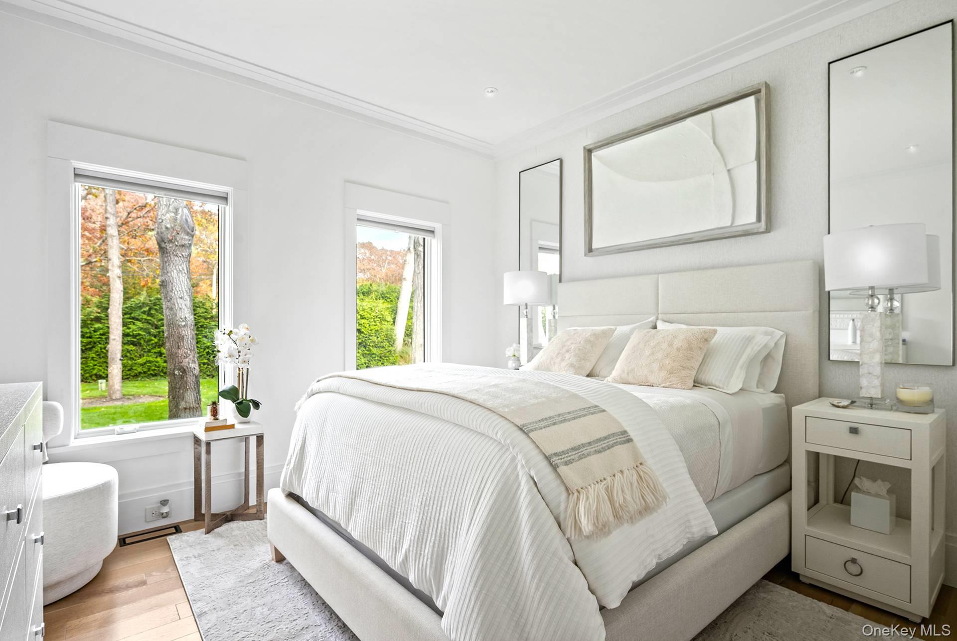 54 Glade Road East Hampton, NY 11937 - Photo 27 of 35 a bed room with a bed and a window
