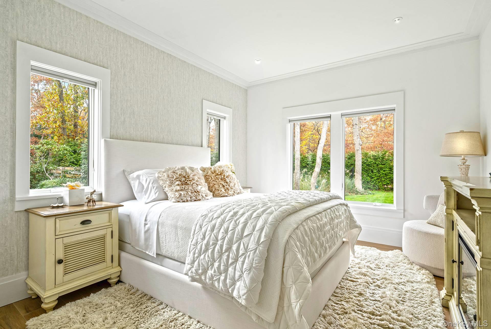 54 Glade Road East Hampton, NY 11937 - Photo 28 of 35 a bedroom with a bed and a window