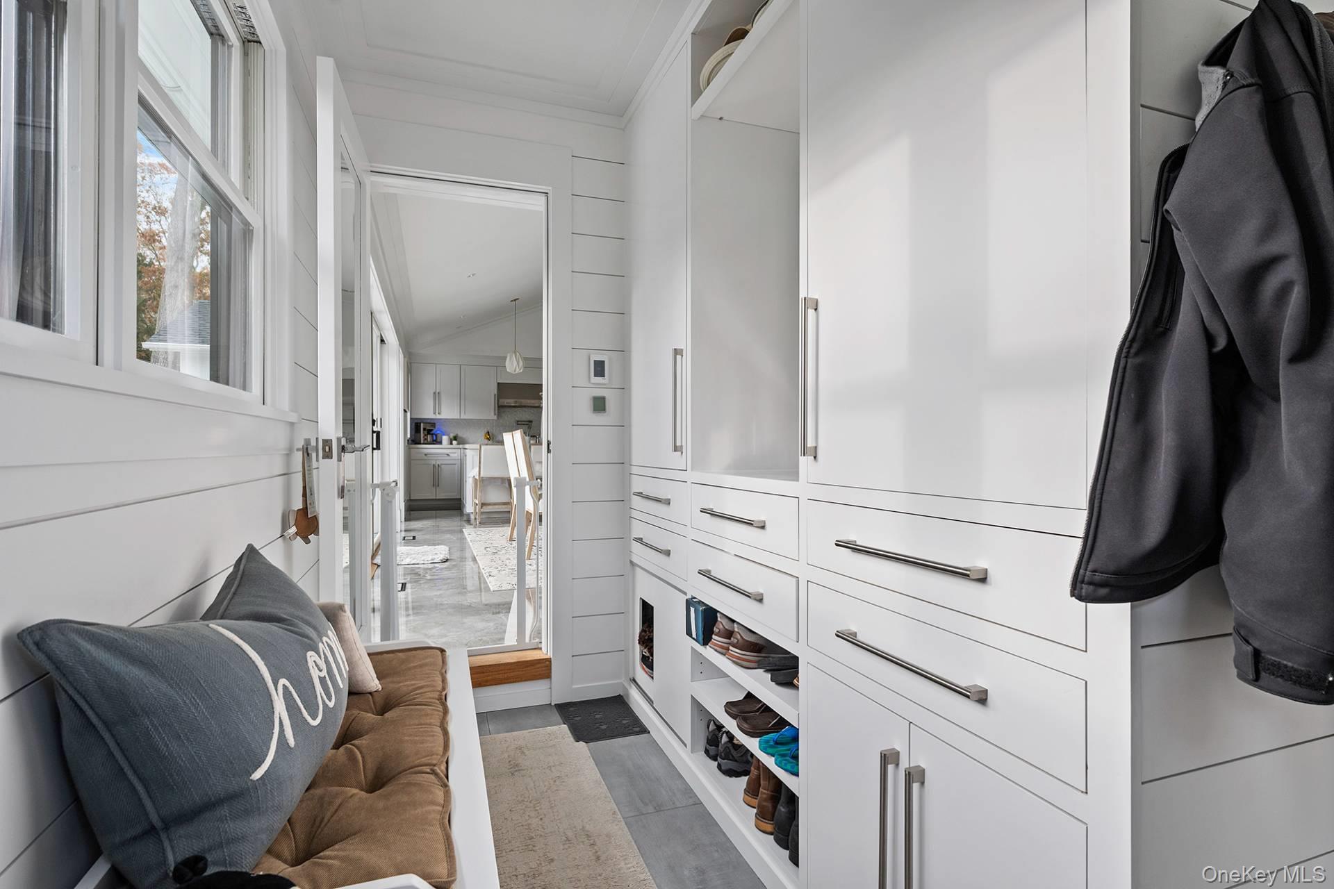 54 Glade Road East Hampton, NY 11937 - Photo 30 of 35 a view of walk in closet with clothes and shoes