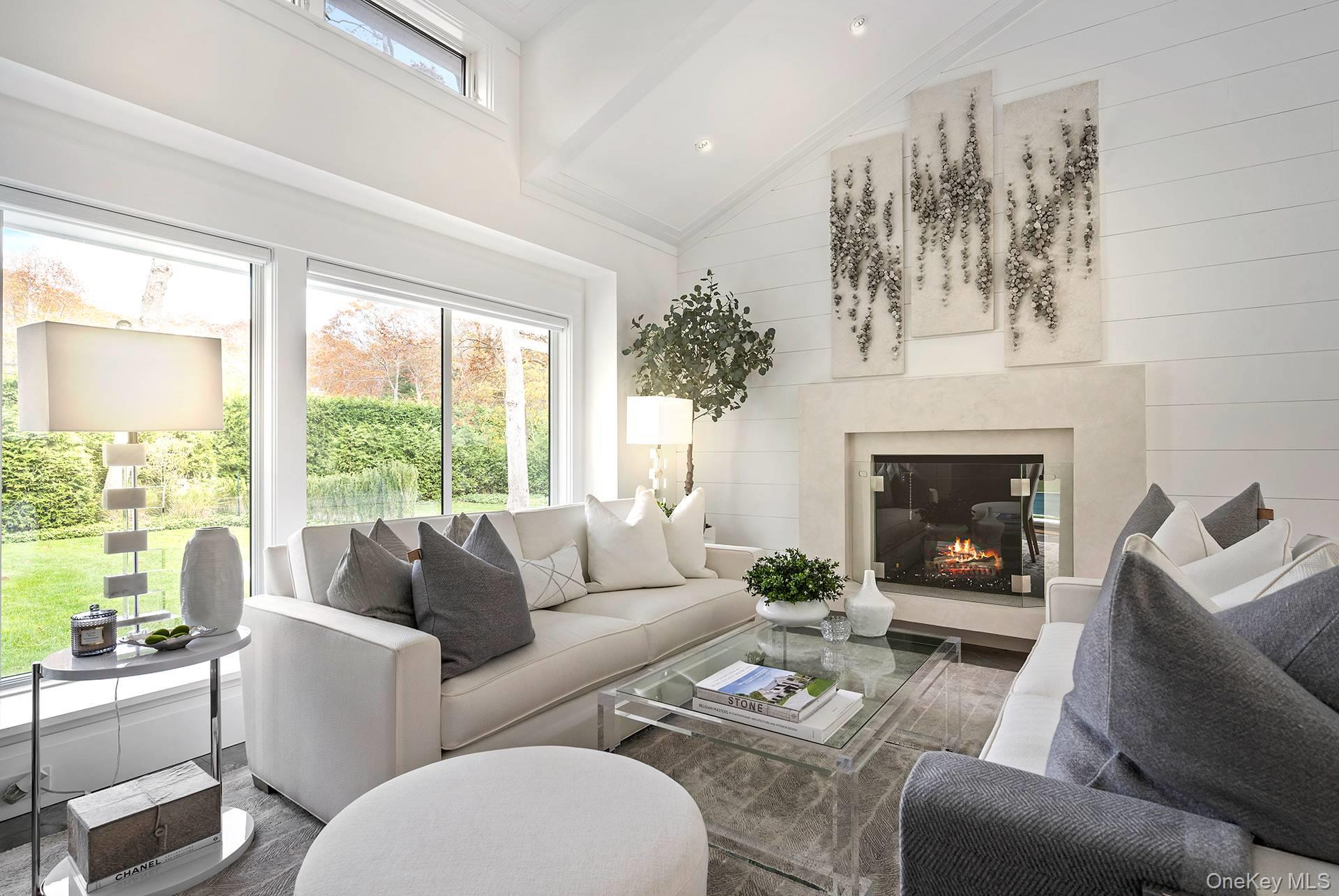 54 Glade Road East Hampton, NY 11937 - Photo 7 of 35 a living room with furniture fireplace and a large window