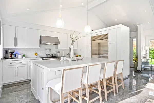 a kitchen with a sink cabinets and window