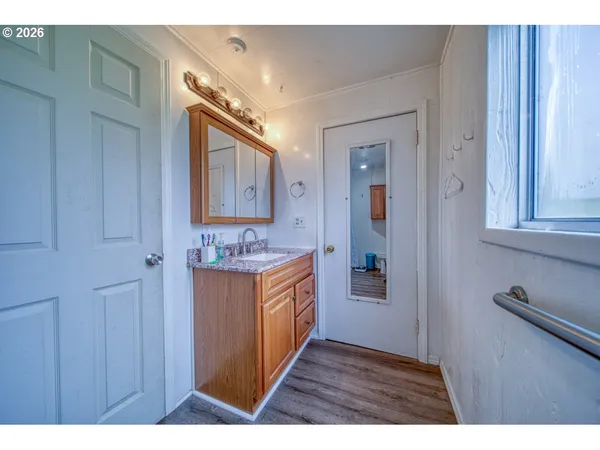 a bathroom with a sink a mirror and a bathtub