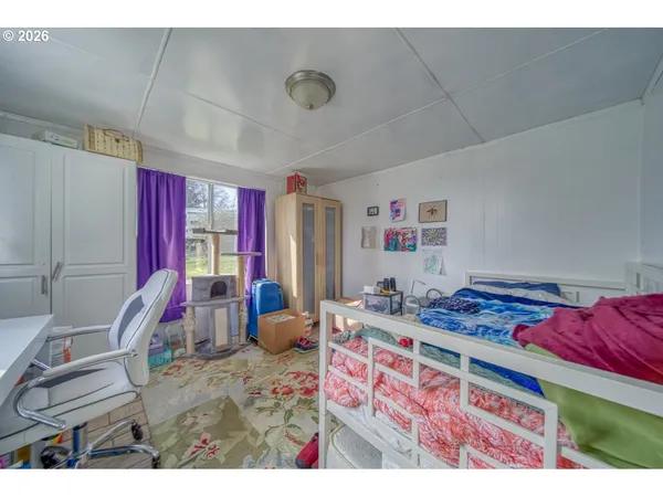 a bedroom with furniture and a bed