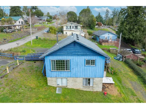 a view of a house with a yard balcony and sitting area