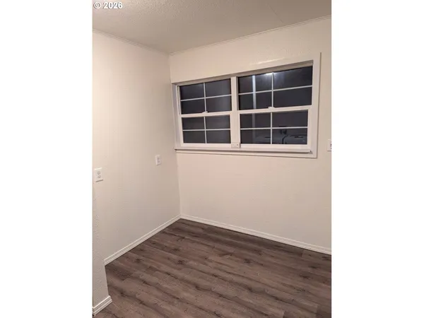 a view of empty room with windows