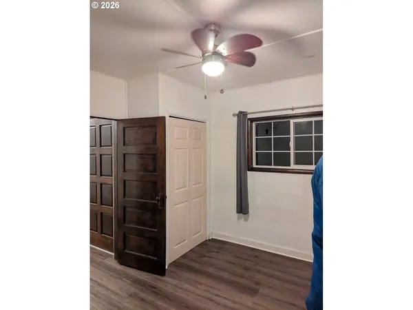 a view of a livingroom with wooden floor