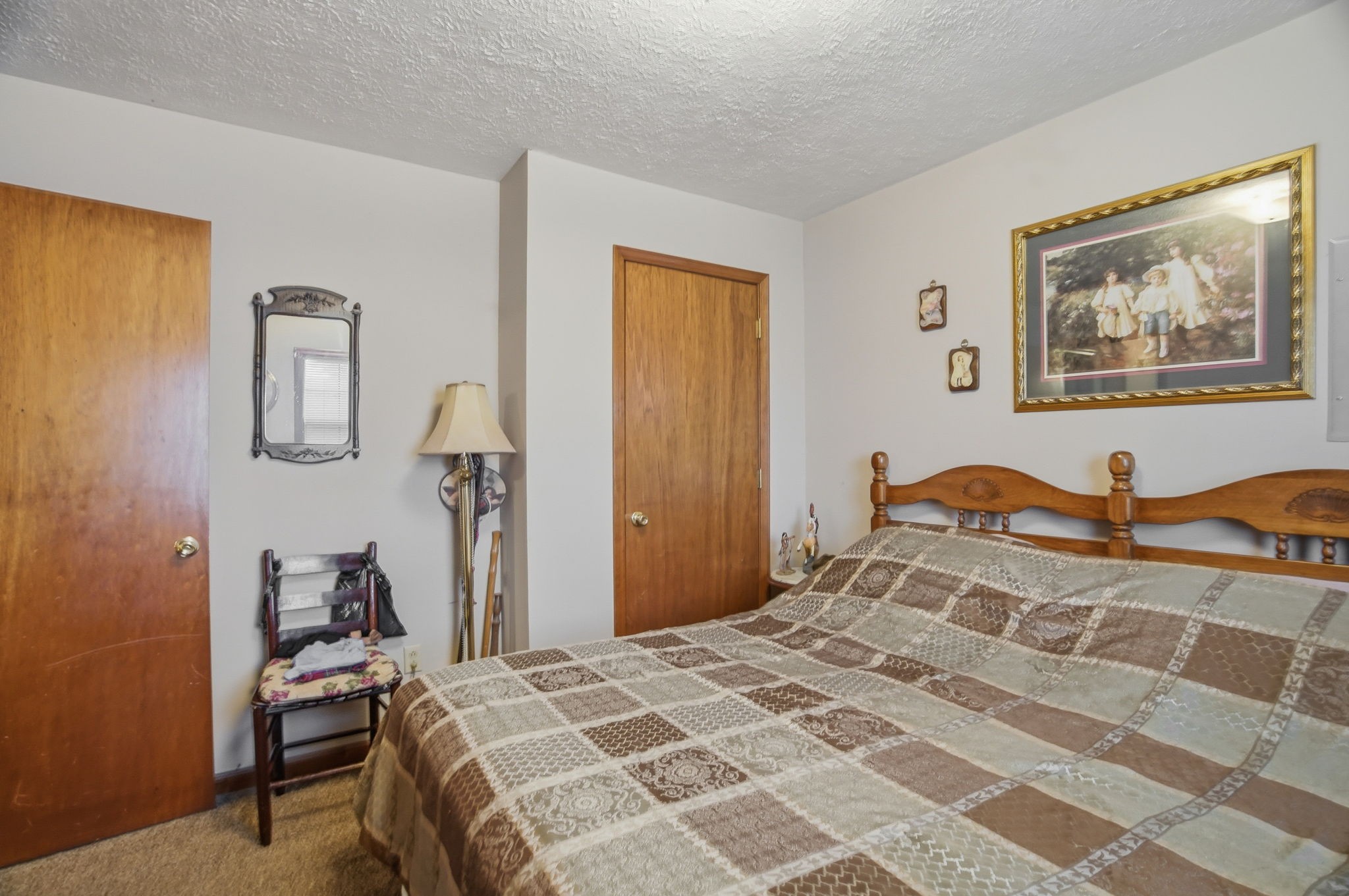 115 Gayla Court Portland, TN 37148 - Photo 22 of 46 a bedroom with a bed and a painting on the wall