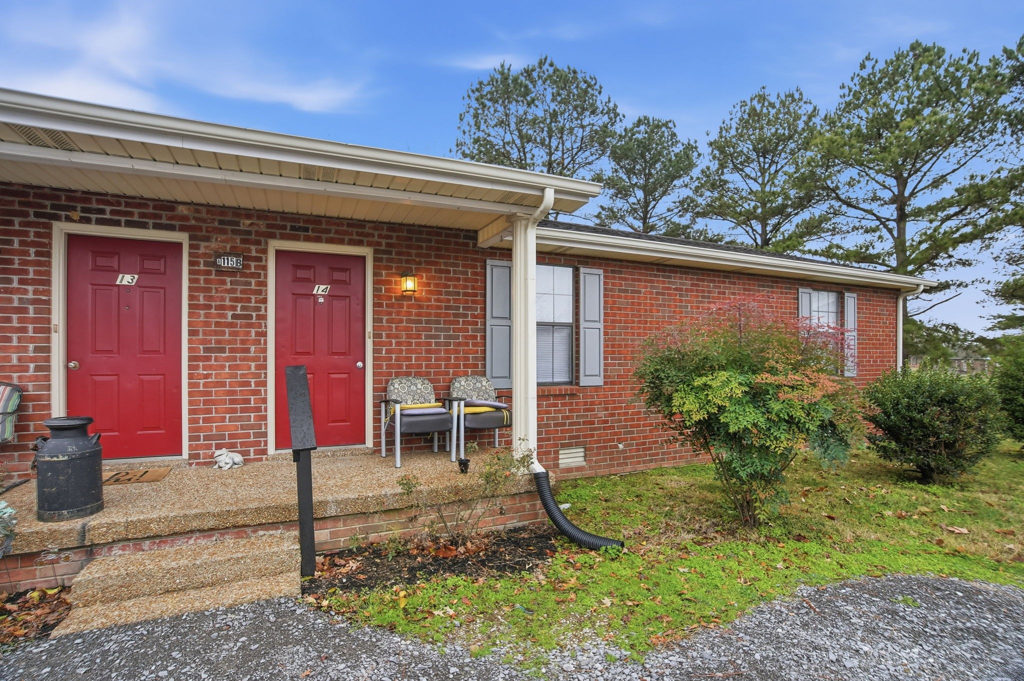115 Gayla Court Portland, TN 37148 - Photo 28 of 46 a view of a house with brick walls and a yard with plants