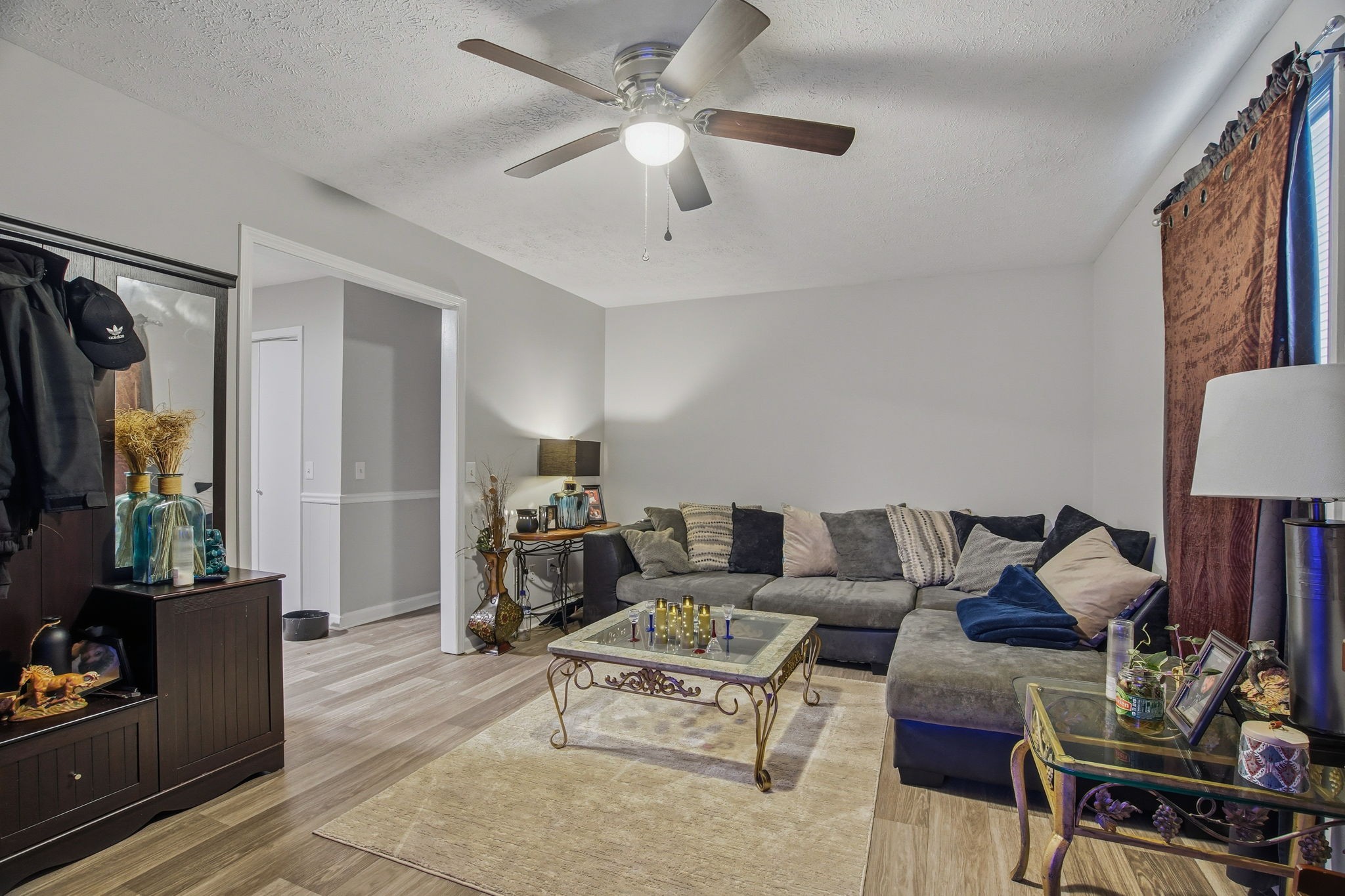115 Gayla Court Portland, TN 37148 - Photo 30 of 46 a living room with furniture a flat screen tv and a window