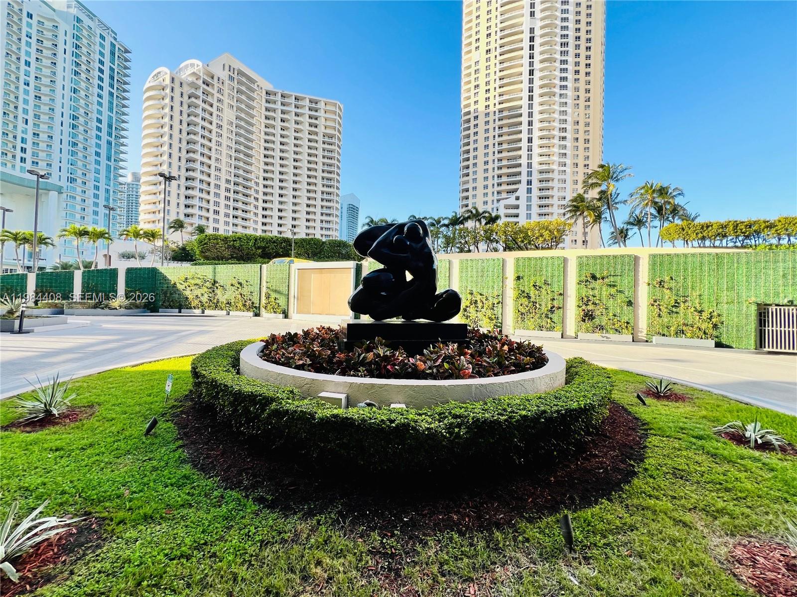 540 Brickell Key Drive, Unit 202 Miami, FL 33131 - Photo 29 of 31 a view of a garden with a fountain