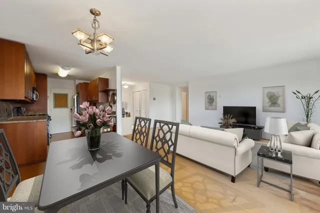 a living room with fireplace furniture and a flat screen tv
