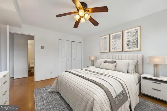 a bedroom with a bed and a lamp