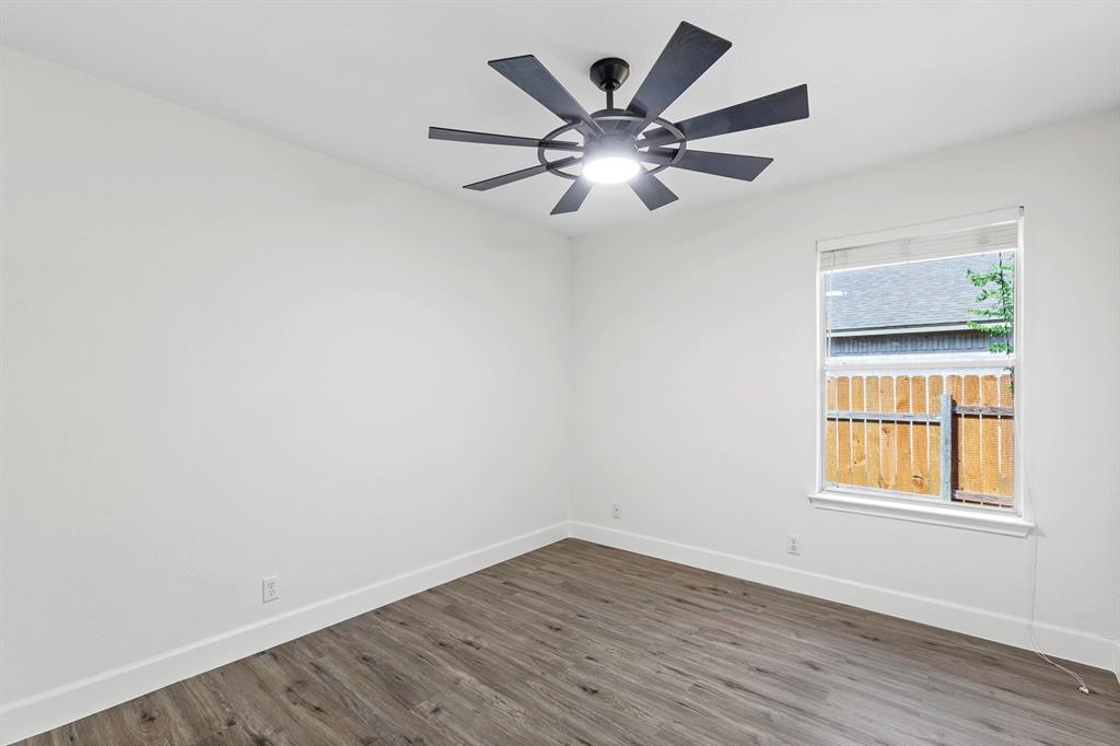 617 Barbara Way Bastrop, TX 78602 - Photo 11 of 20 Laminated flooring and a contemporary ceiling fan elevate this tranquil room.