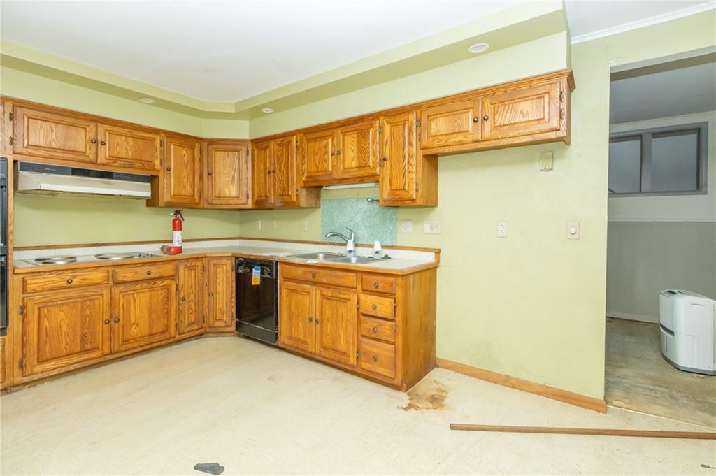 1180 Chestnut Street Indiana, PA 15701 - Photo 8 of 24 a kitchen with stainless steel appliances granite countertop a sink and cabinets