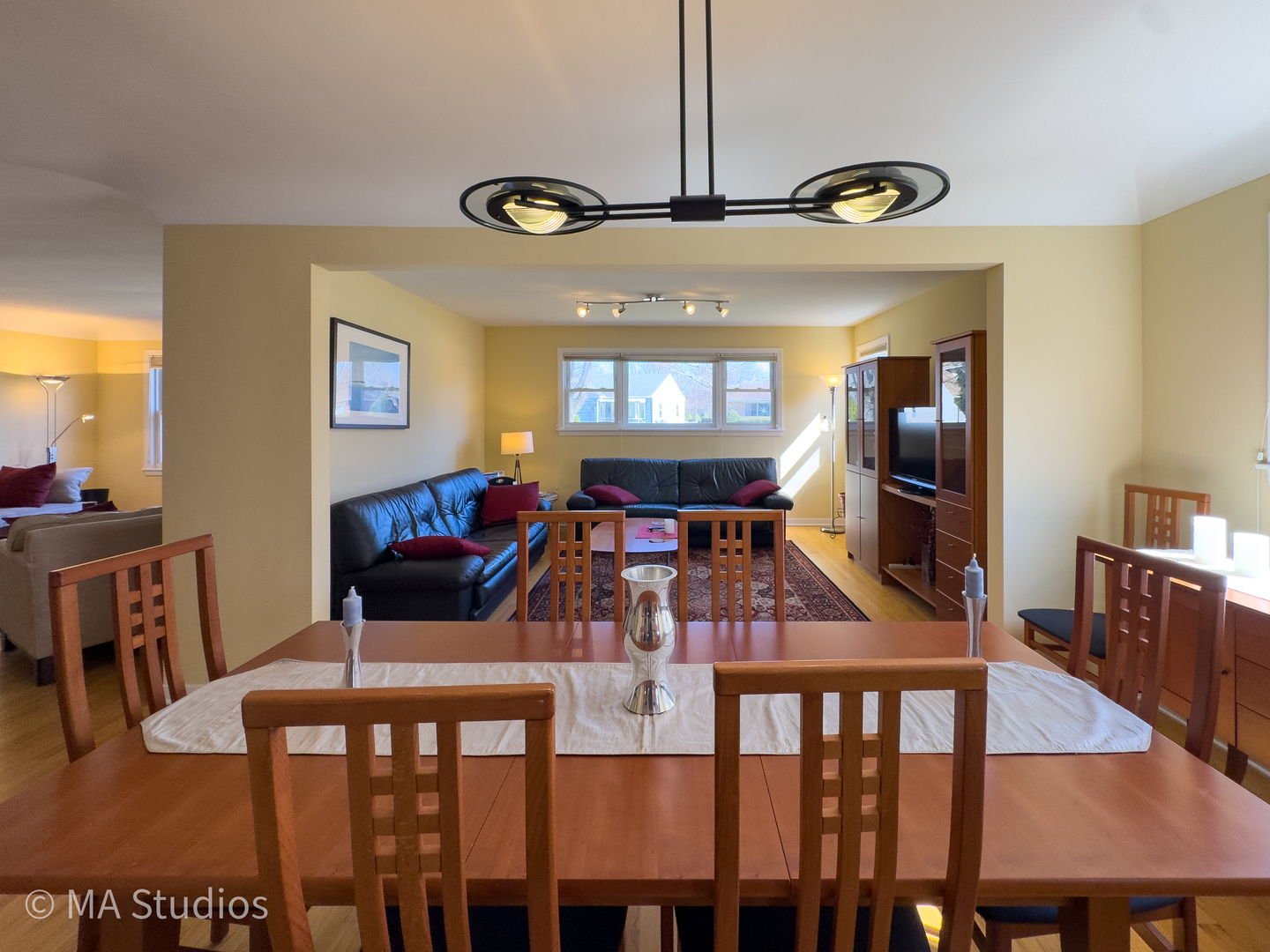 8912 Harms Road Morton Grove, IL 60053 - Photo 11 of 85 a view of a dining room with furniture window and wooden floor