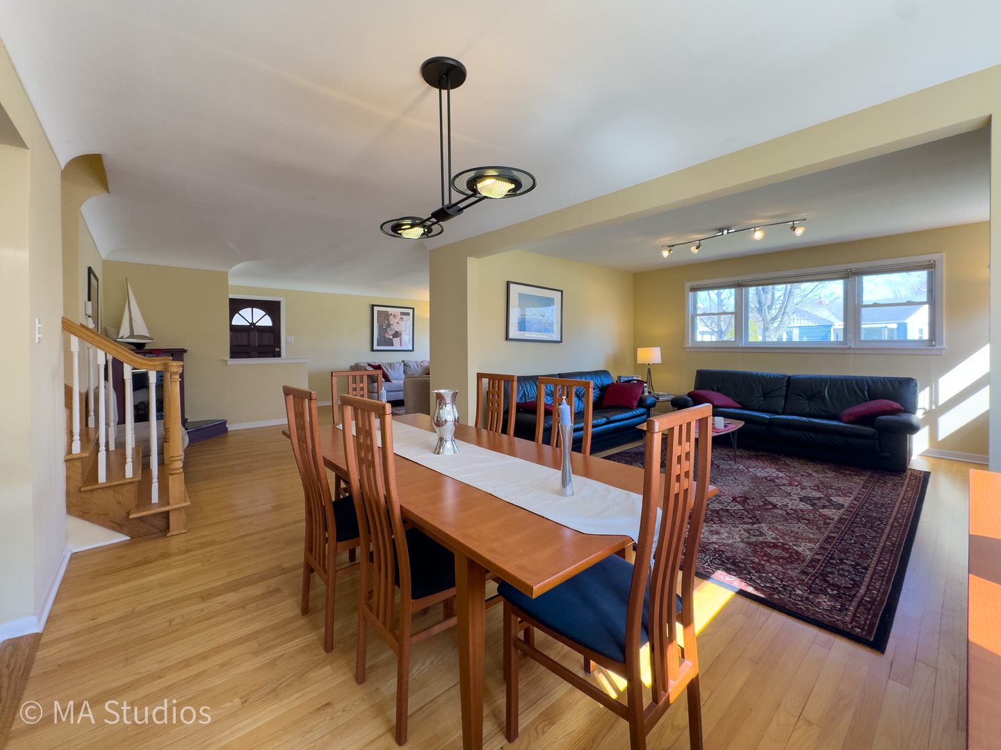 8912 Harms Road Morton Grove, IL 60053 - Photo 12 of 85 a living room with lots of furniture and a chandelier