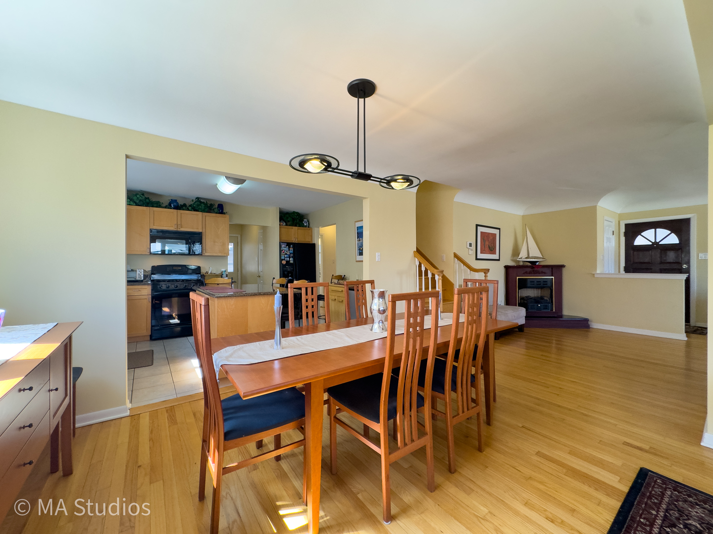 8912 Harms Road Morton Grove, IL 60053 - Photo 13 of 85 a view of a dining room with furniture and wooden floor