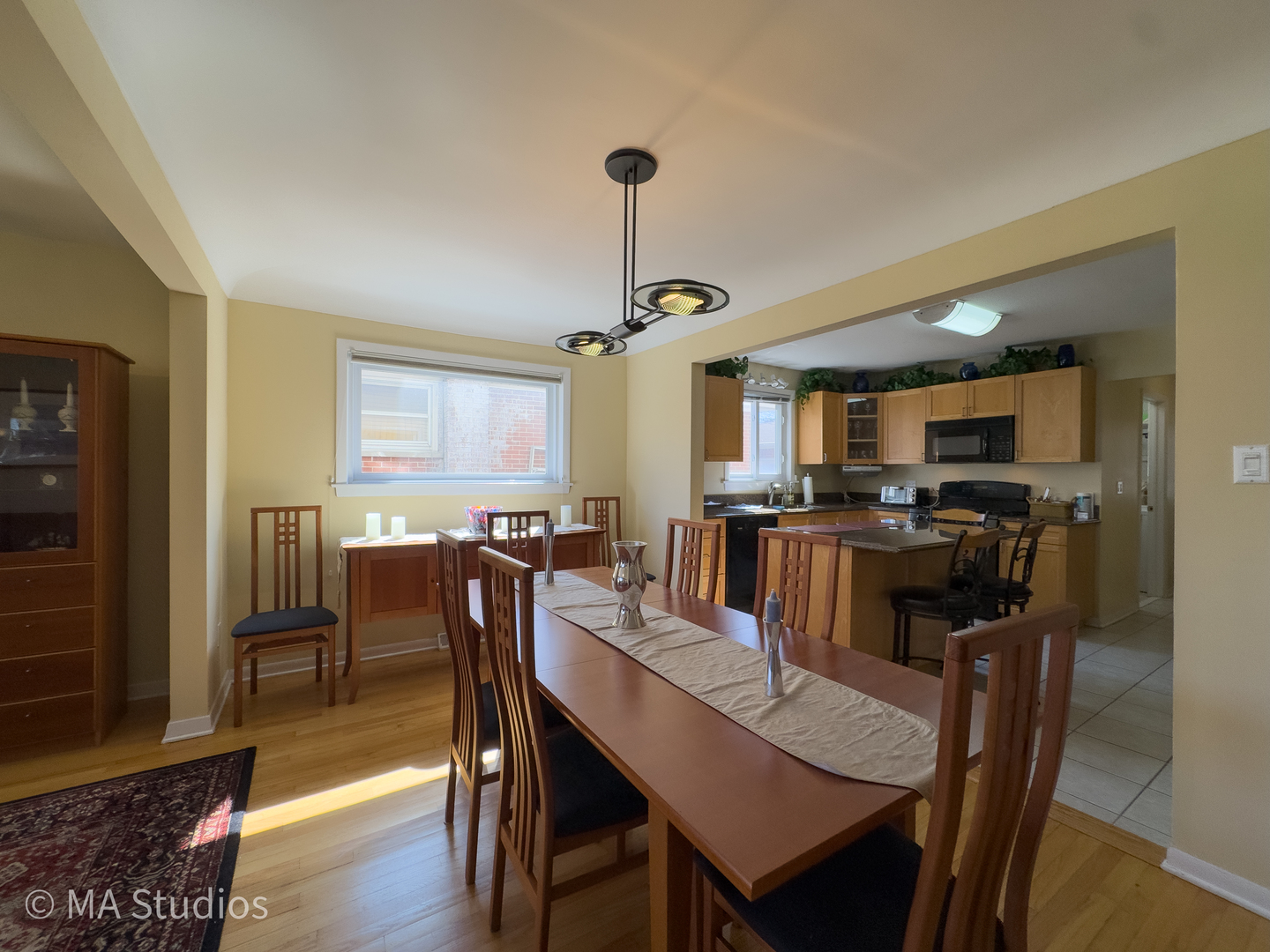 8912 Harms Road Morton Grove, IL 60053 - Photo 14 of 85 a view of a dining room with furniture window and wooden floor