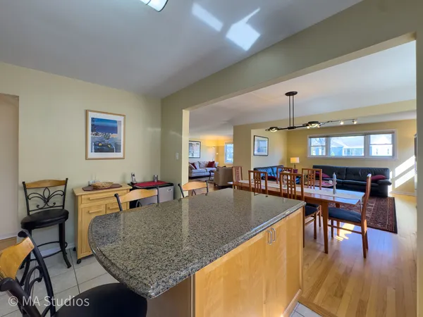 a kitchen with stainless steel appliances granite countertop a stove and a refrigerator