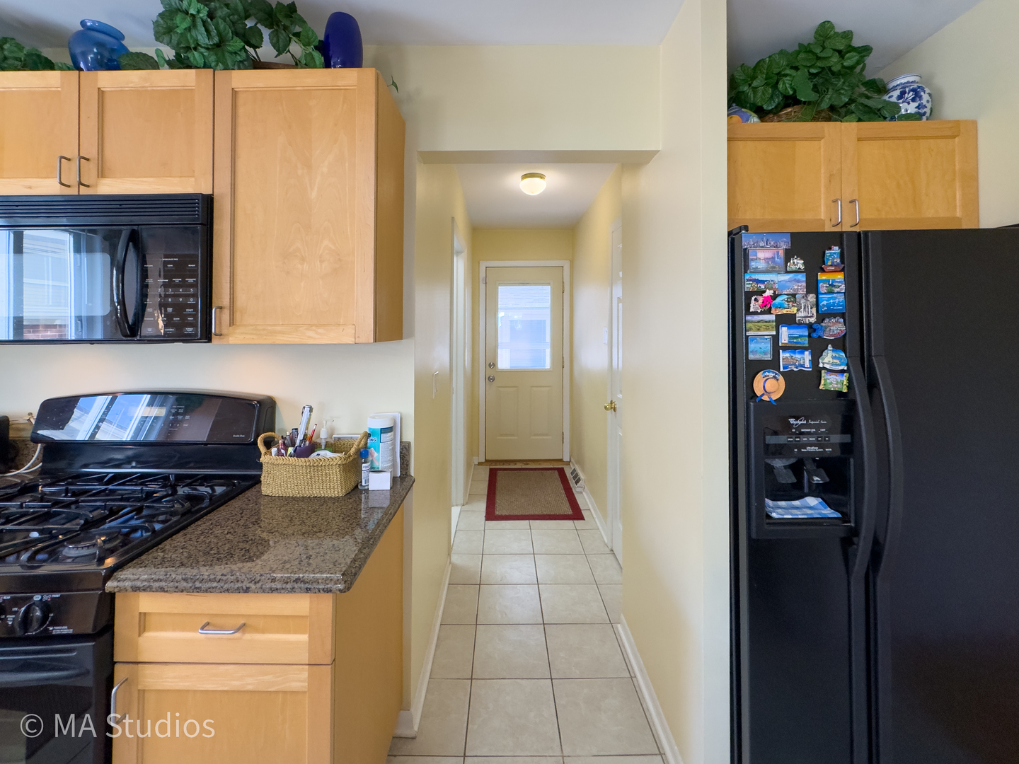 8912 Harms Road Morton Grove, IL 60053 - Photo 23 of 85 a kitchen with stainless steel appliances granite countertop a stove and a refrigerator