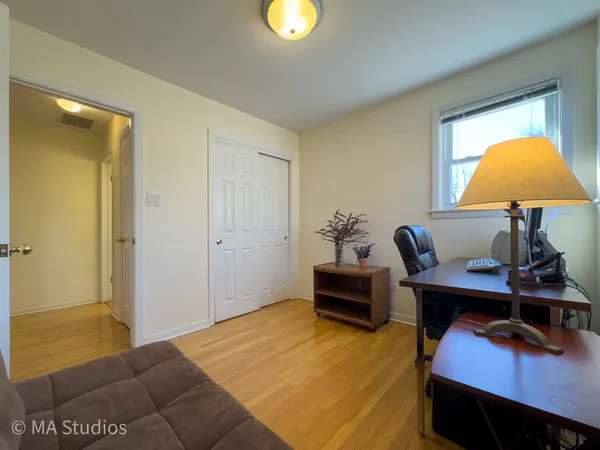 a view of a hallway with a couch