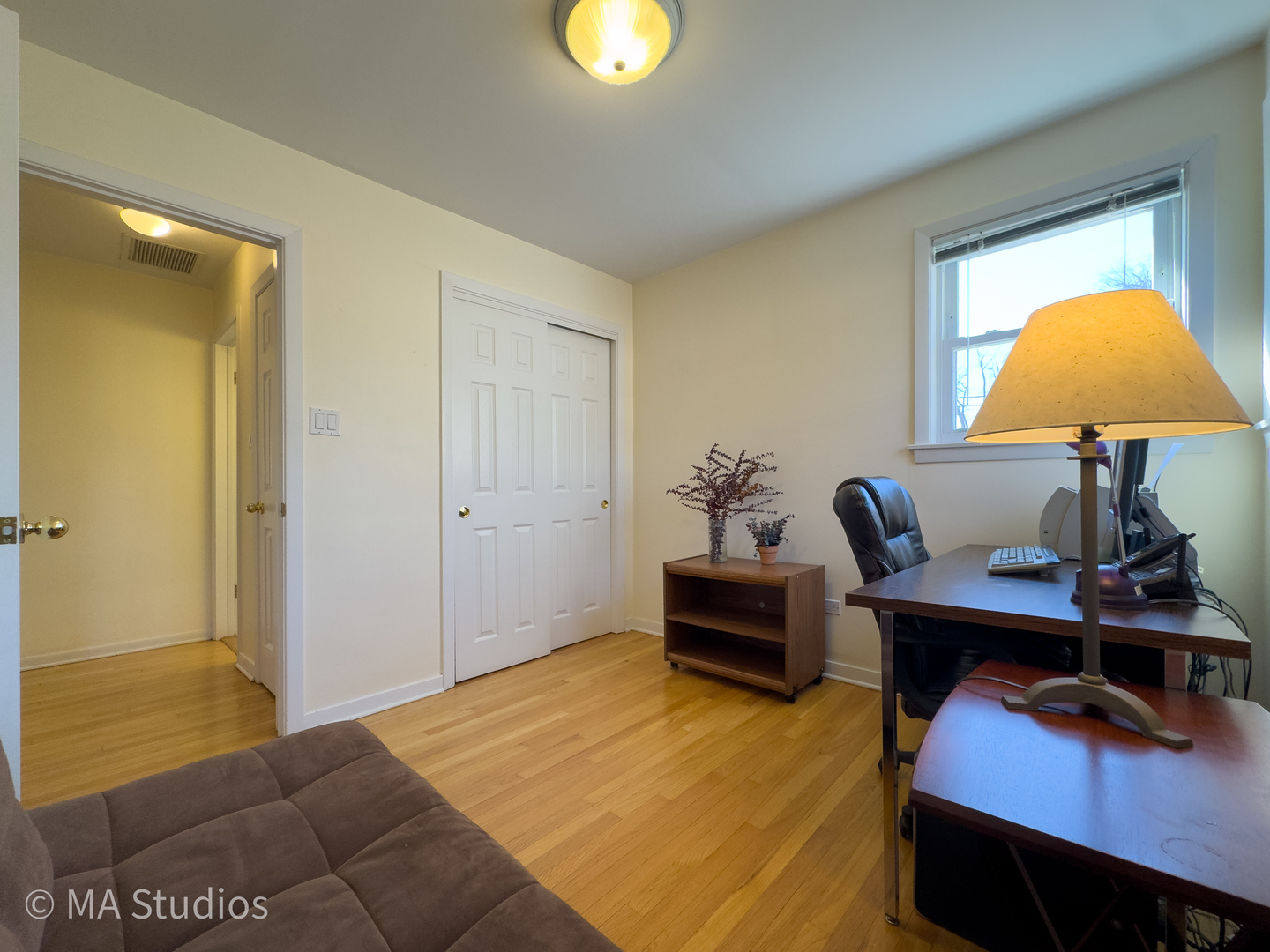 8912 Harms Road Morton Grove, IL 60053 - Photo 28 of 85 a view of a workspace with furniture and chandelier