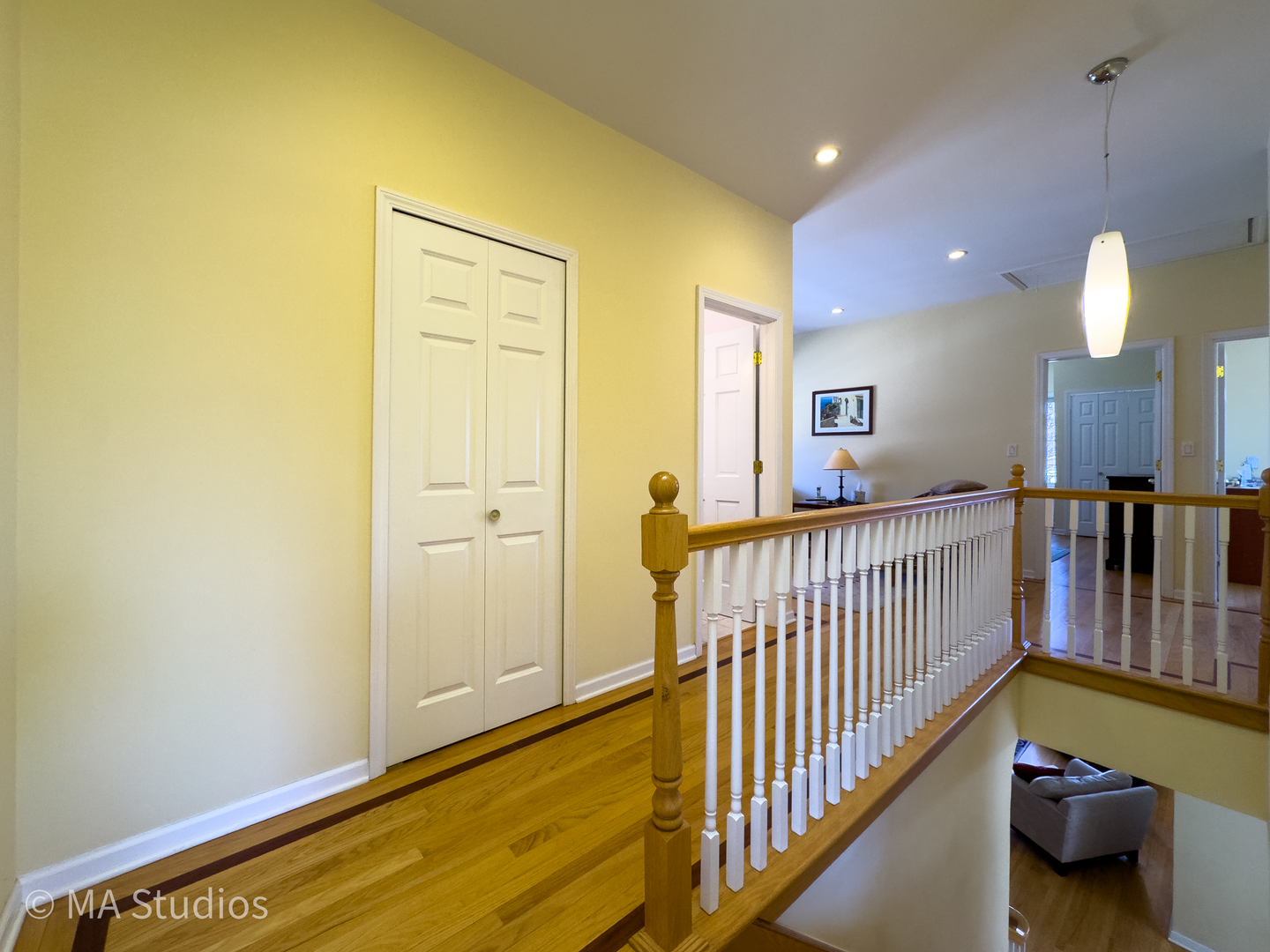 8912 Harms Road Morton Grove, IL 60053 - Photo 34 of 85 a view of a hallway with dining room and chandelier