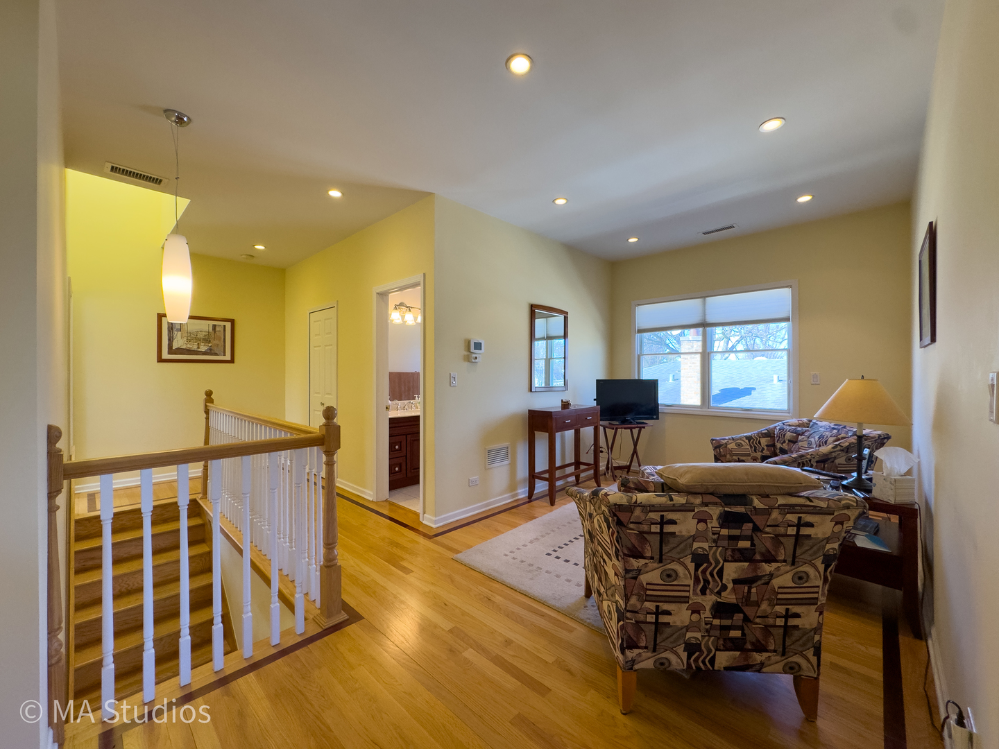 8912 Harms Road Morton Grove, IL 60053 - Photo 36 of 85 a living room with furniture and a wooden floor