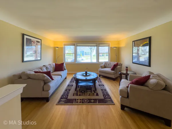 a living room with furniture rug and window